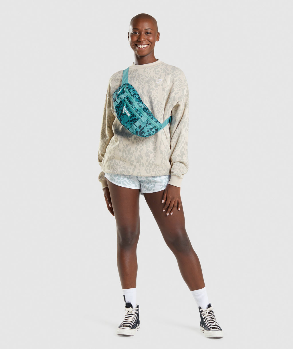 gymshark-adapt-animal-graphic-sling-bag-teal-print-aw21