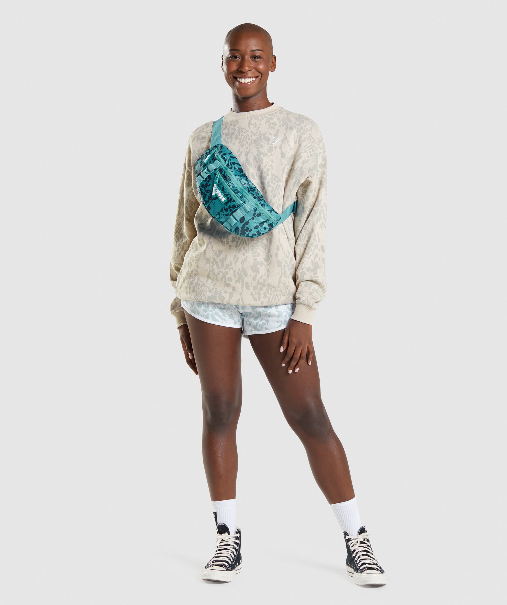 gymshark-adapt-animal-graphic-sling-bag-teal-print-aw21