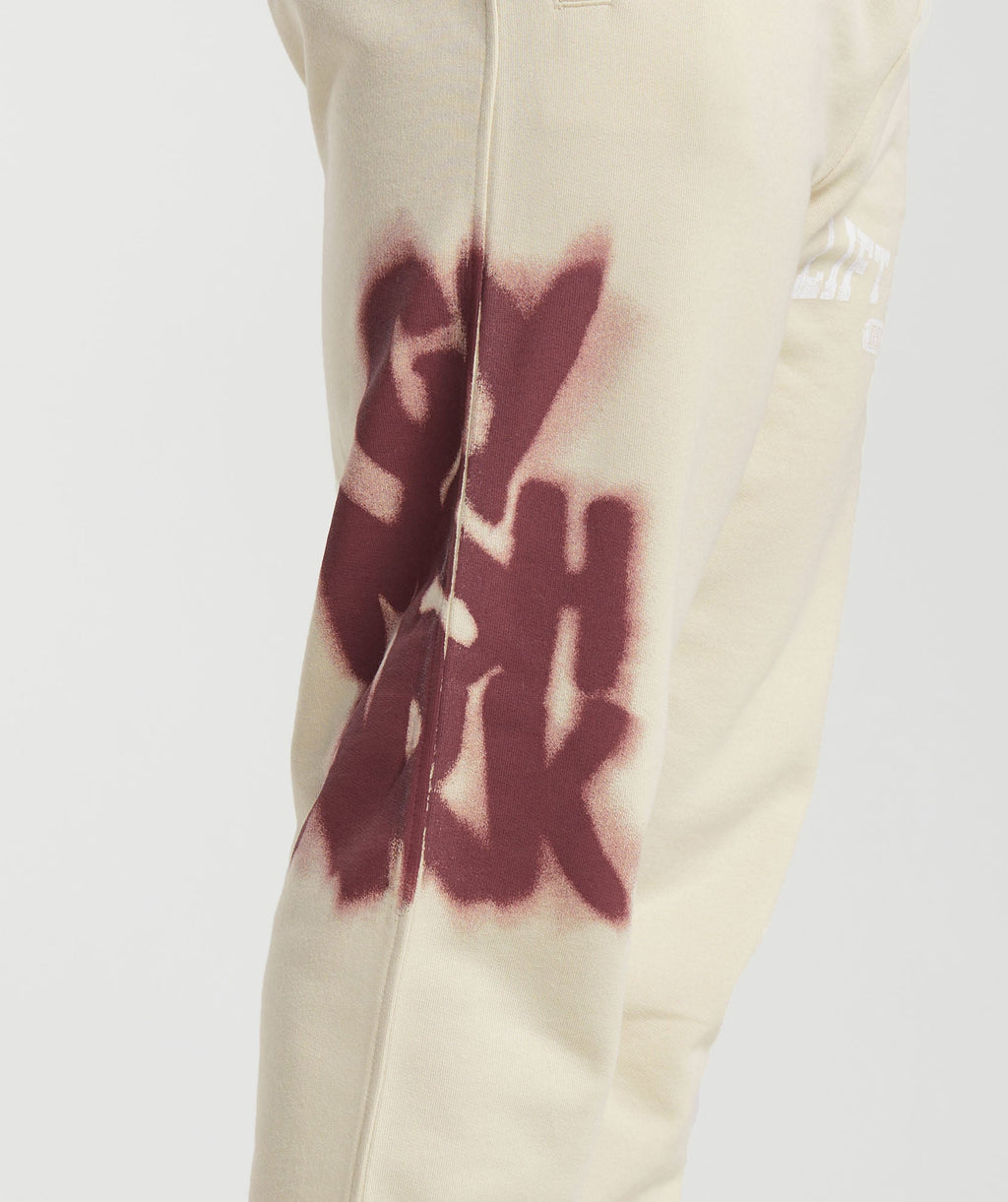 gymshark-lifting-department-graffiti-joggers-ecru-white-ss24