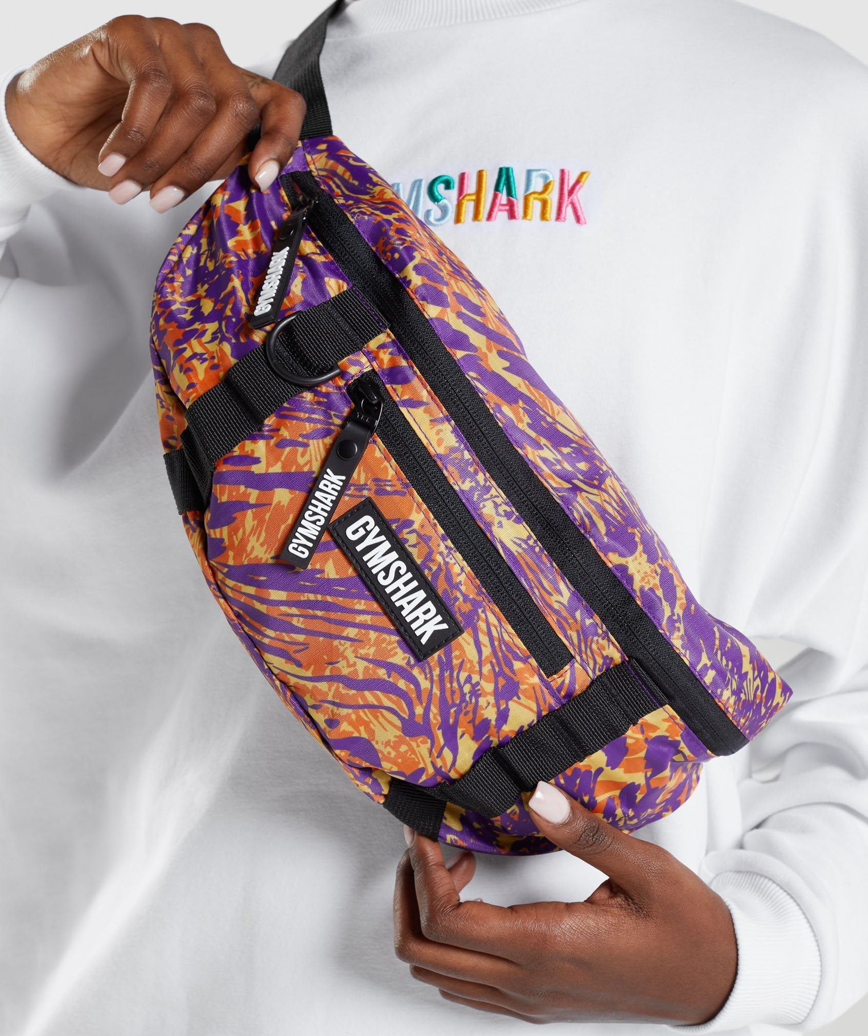 gymshark-animal-print-sling-bag-orange-print-aw21