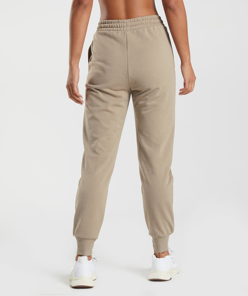gymshark-social-club-joggers-cement-brown-aw22