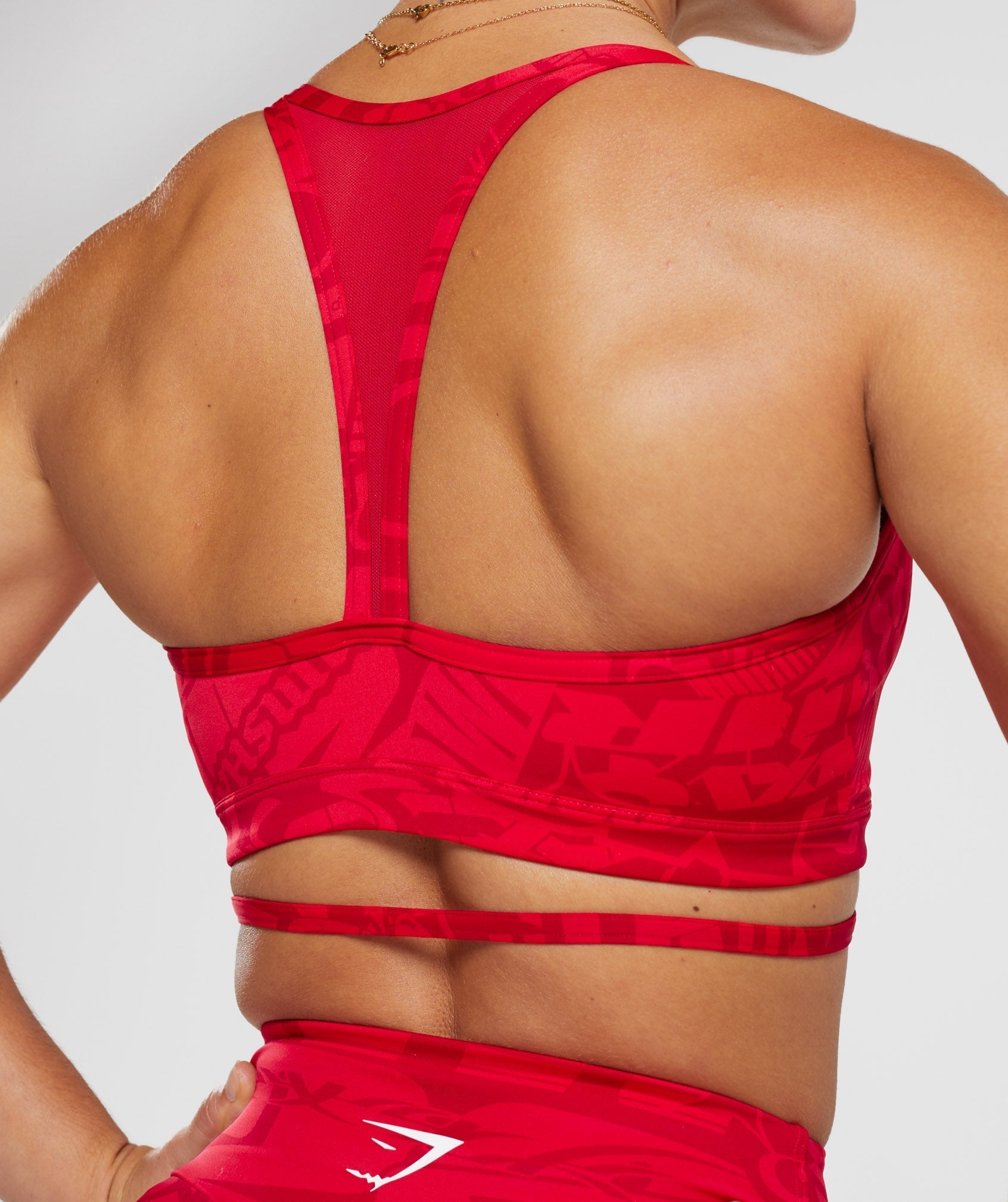 gs-power-strappy-sports-bra-zesty-red-aw23