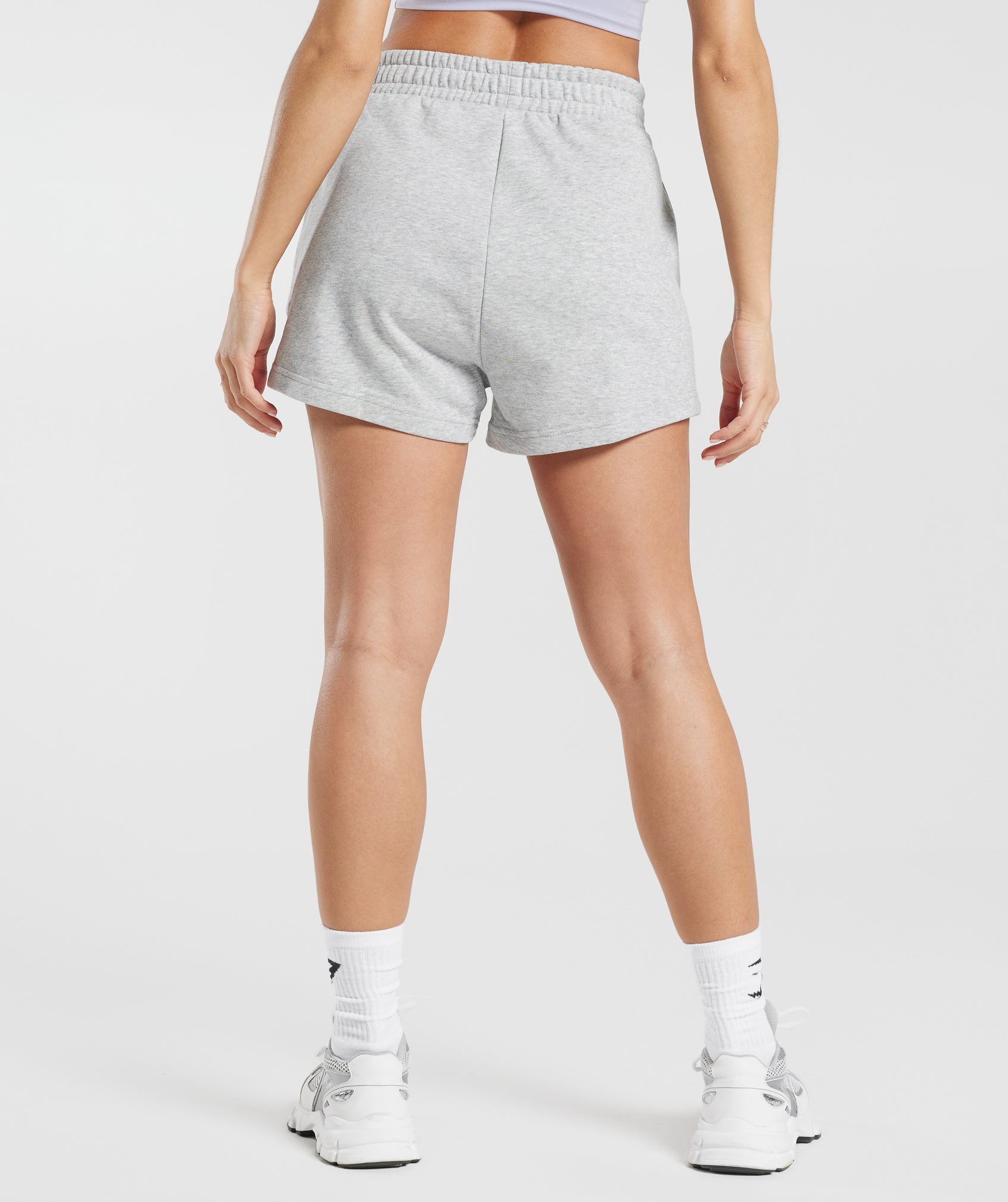 gymshark-strong-peach-graphic-shorts-light-grey-marl-ss23