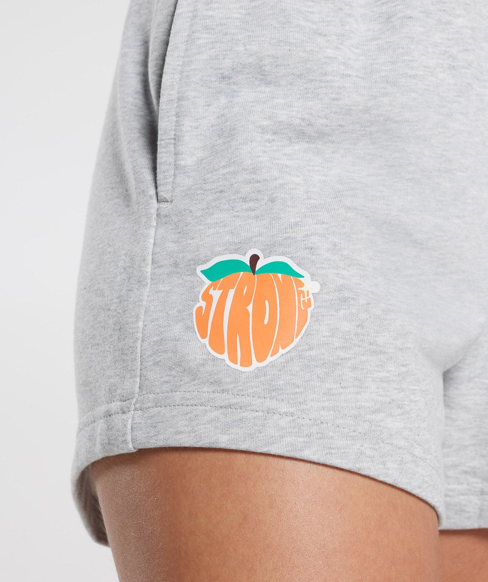 gymshark-strong-peach-graphic-shorts-light-grey-marl-ss23