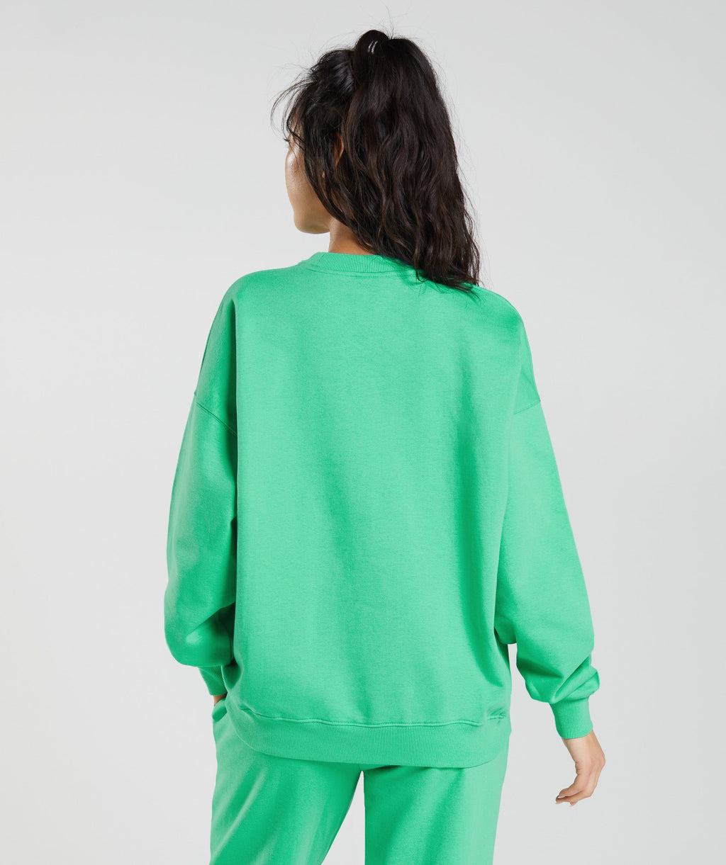 gymshark-activated-graphic-sweatshirt-tropic-green-ss23