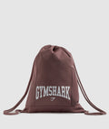 gymshark-gfx-collegiate-gymsack-dusty-maroon-ss23