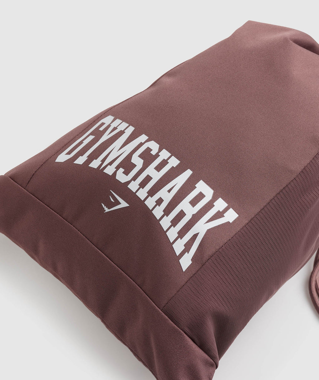 gymshark-gfx-collegiate-gymsack-dusty-maroon-ss23