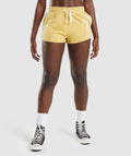 gymshark-legacy-graphic-shorts-yellow-aw21