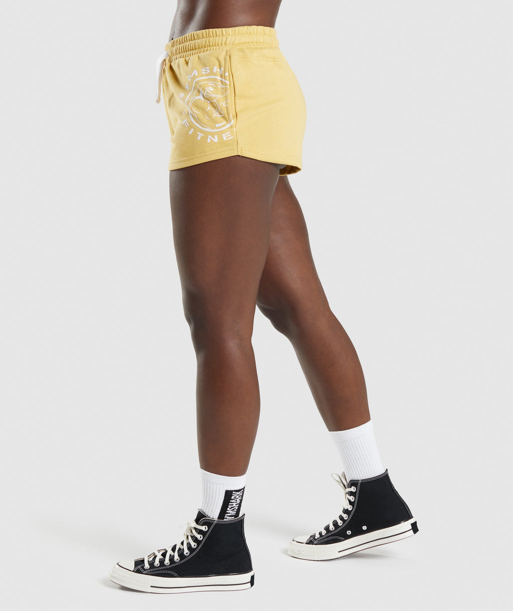 gymshark-legacy-graphic-shorts-yellow-aw21