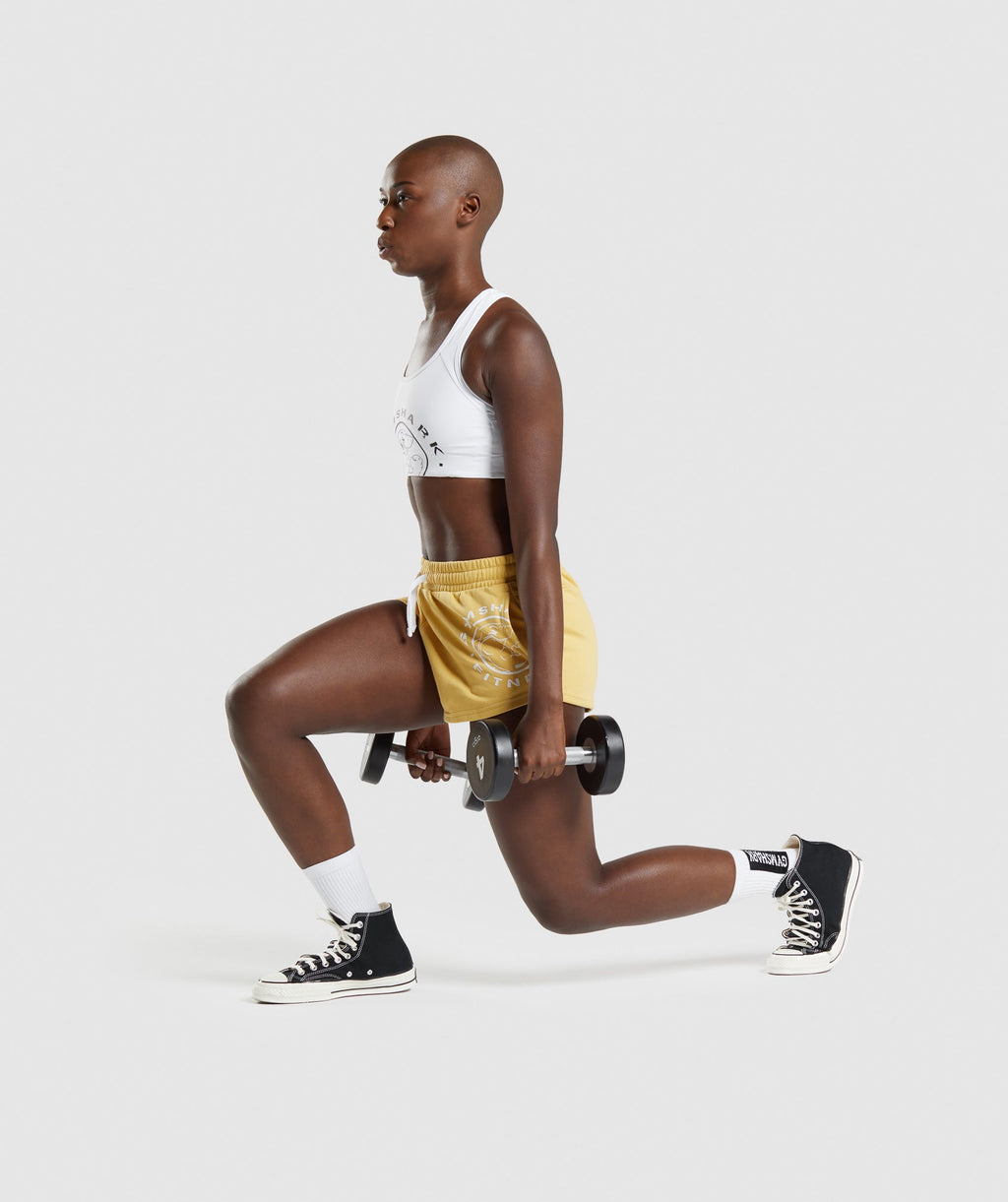 gymshark-legacy-graphic-shorts-yellow-aw21