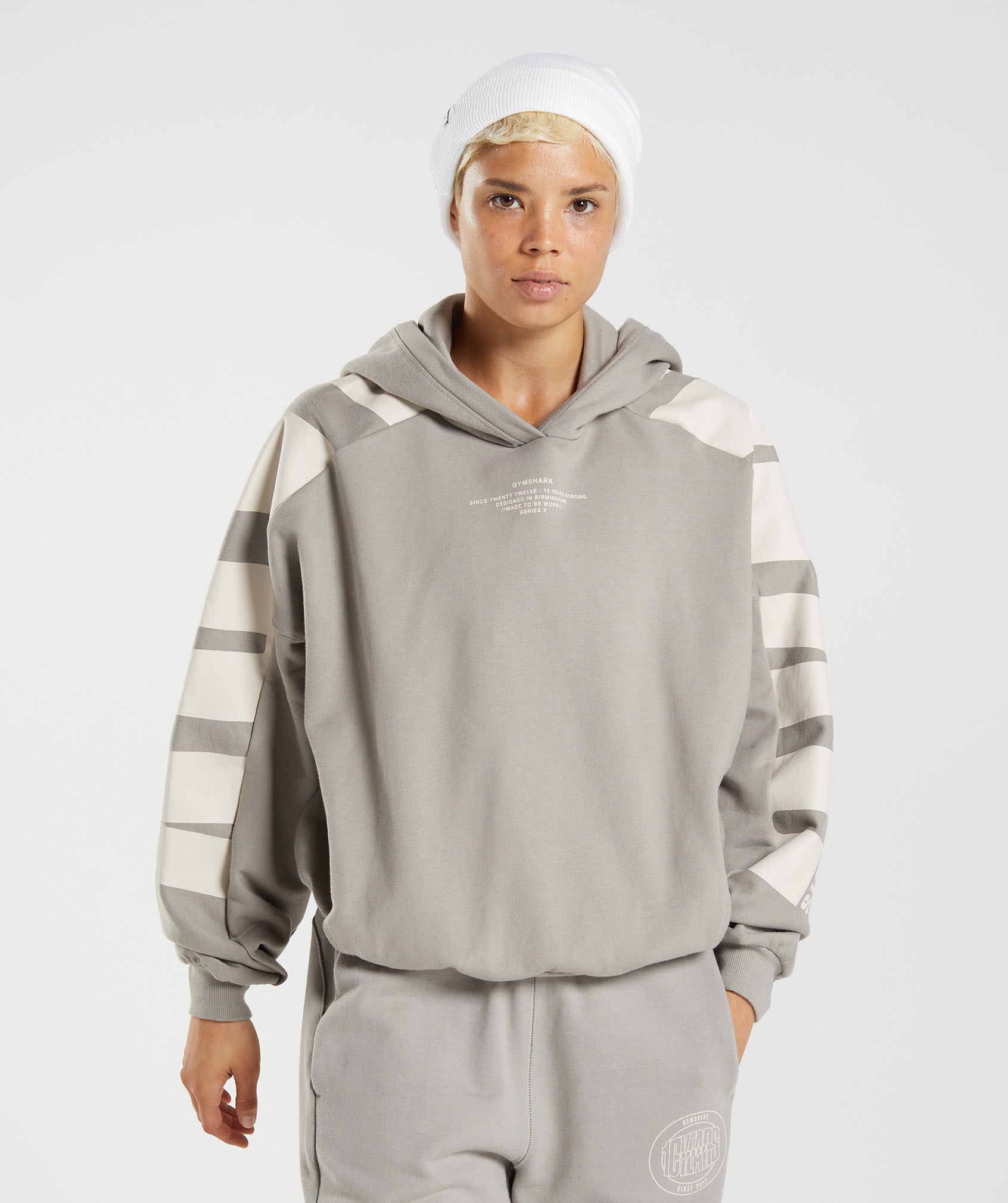 gymshark-gs10-year-hoodie-ecru-brown-aw22