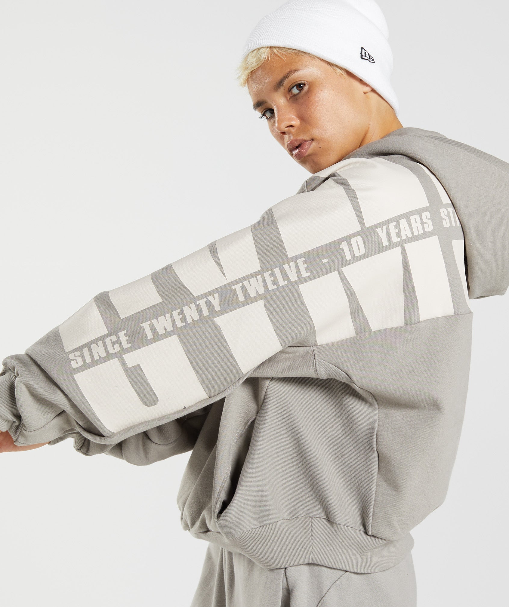 gymshark-gs10-year-hoodie-ecru-brown-aw22