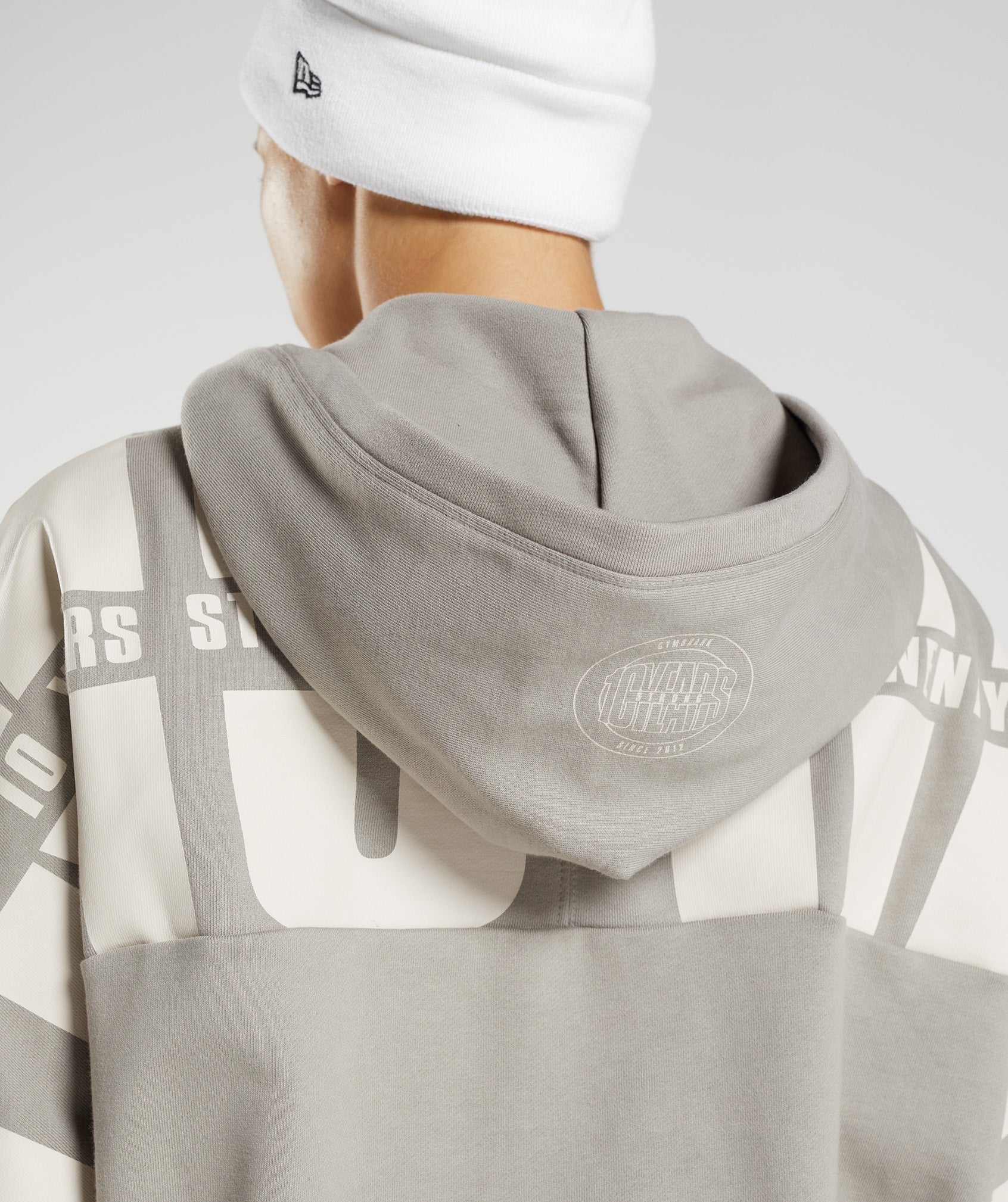 gymshark-gs10-year-hoodie-ecru-brown-aw22