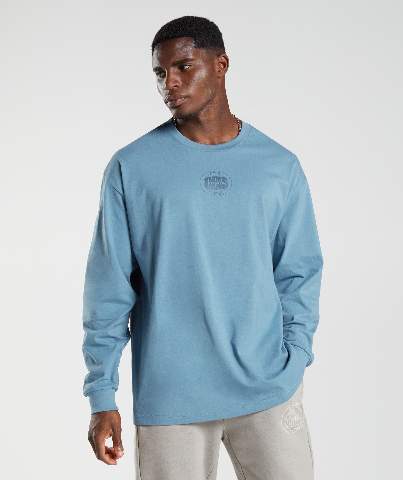 gymshark-gs10-year-oversized-long-sleeve-t-shirt-denim-blue-aw22