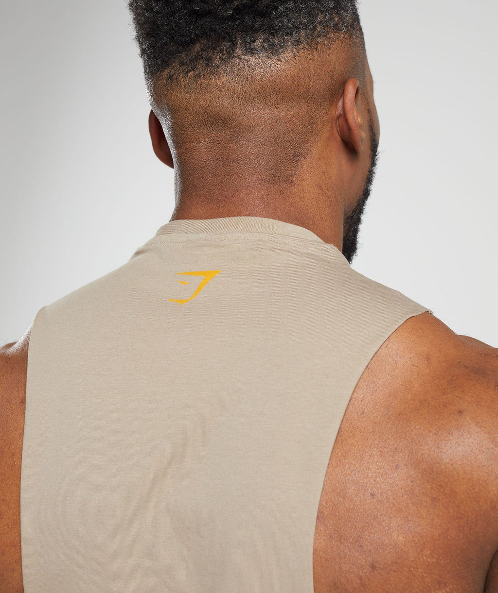 gymshark-heavy-metal-drop-arm-tank-brown-aw23