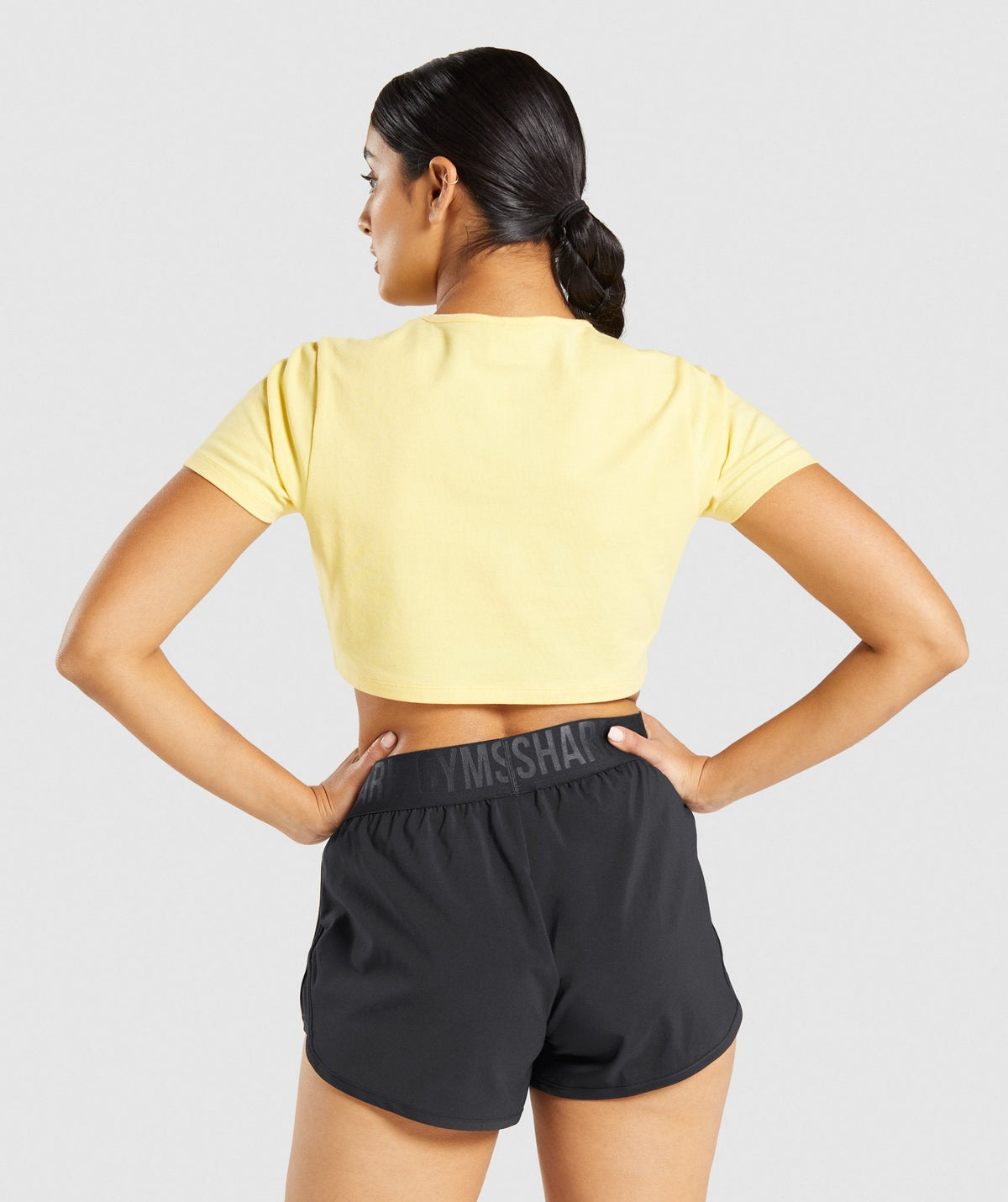 gymshark-italic-graphic-crop-top-yellow