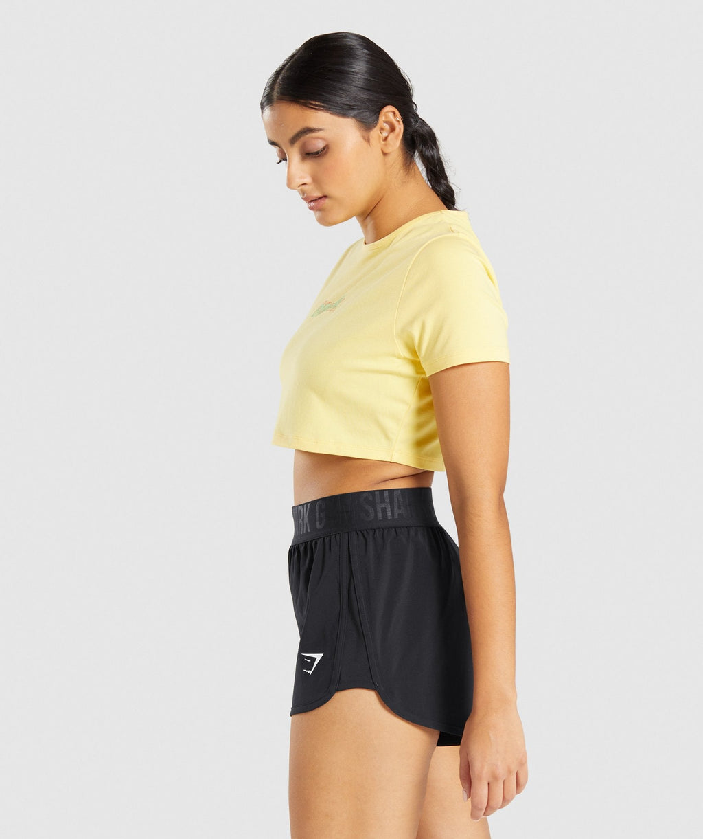 gymshark-italic-graphic-crop-top-yellow