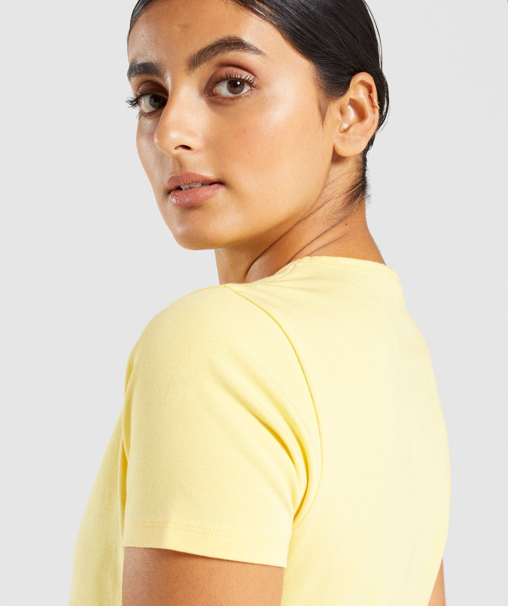 gymshark-italic-graphic-crop-top-yellow