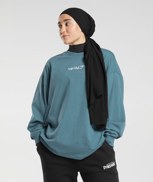 gs-x-leana-deeb-oversized-oversized-long-sleeve-top-mood-blue-aw23