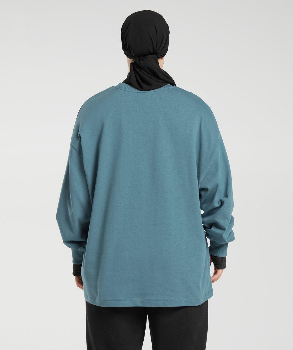 gs-x-leana-deeb-oversized-oversized-long-sleeve-top-mood-blue-aw23