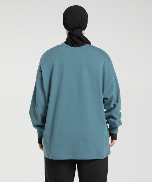 gs-x-leana-deeb-oversized-oversized-long-sleeve-top-mood-blue-aw23