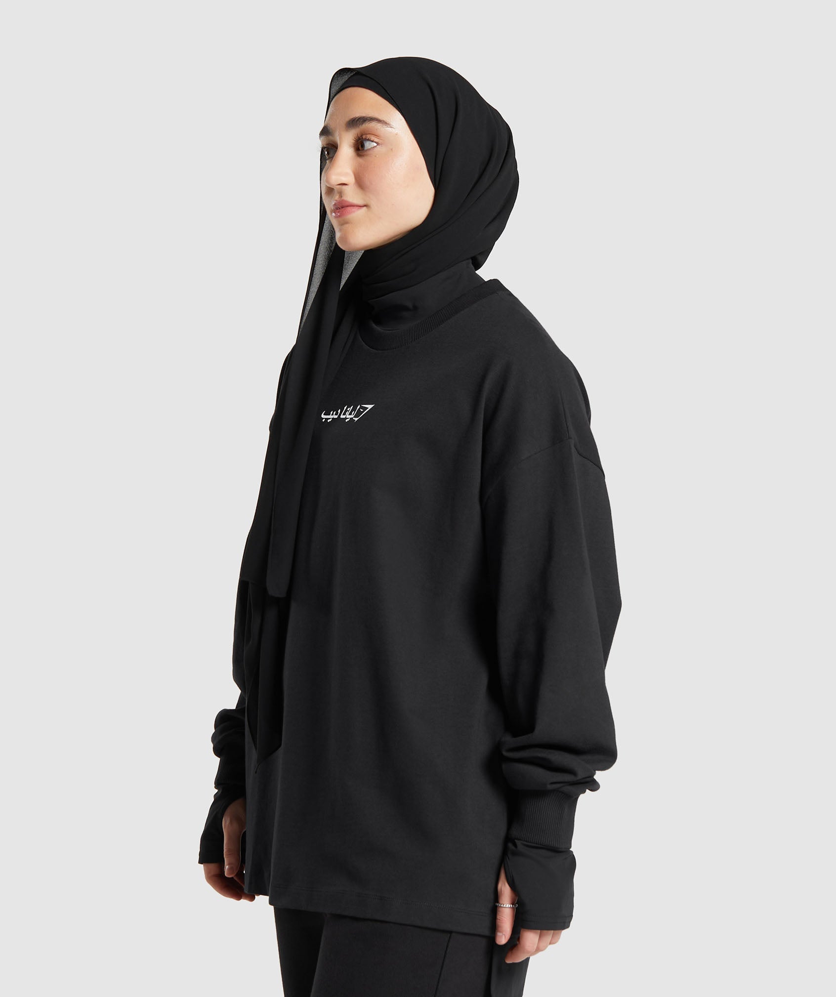 gs-x-leana-deeb-oversized-long-sleeve-top-black-ss24