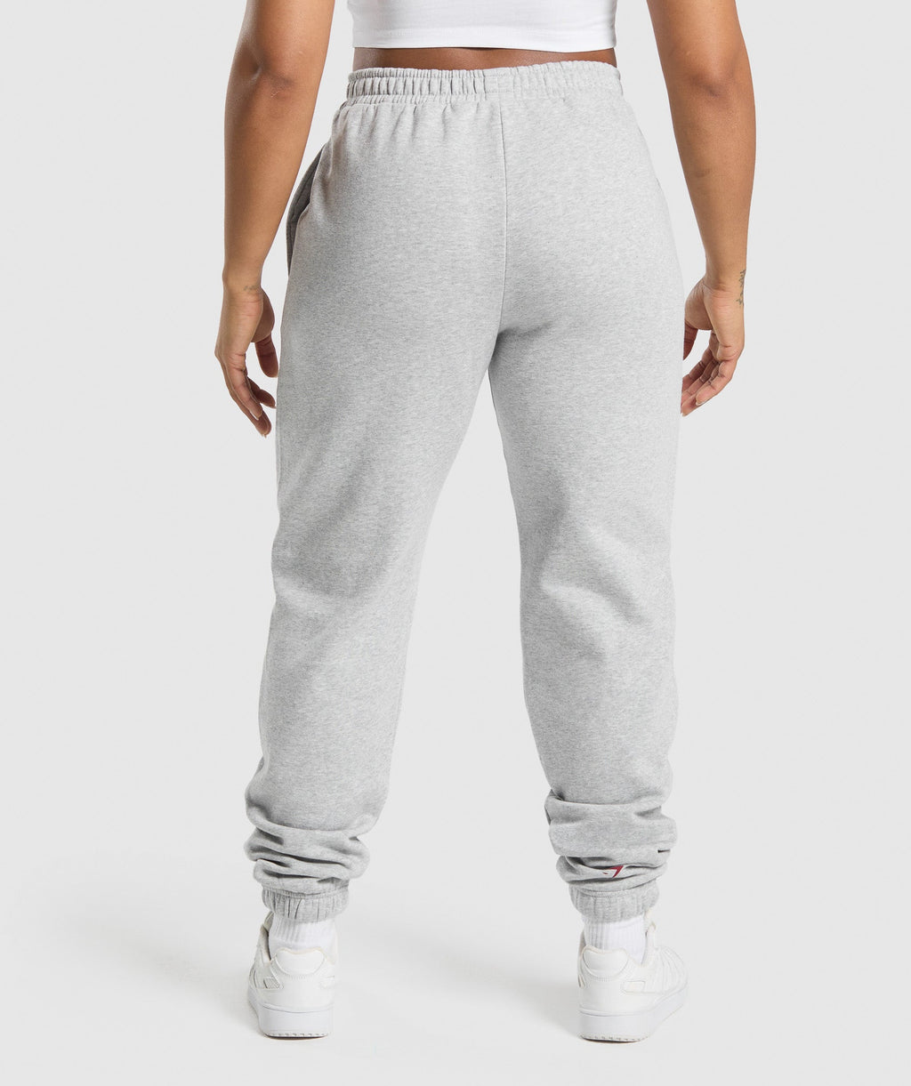 gymshark-lifting-essentials-graphic-brushed-oversized-joggers-light-grey-core-marl-ss25