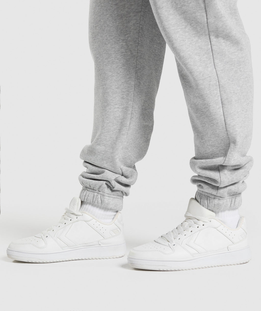 gymshark-lifting-essentials-graphic-brushed-oversized-joggers-light-grey-core-marl-ss25
