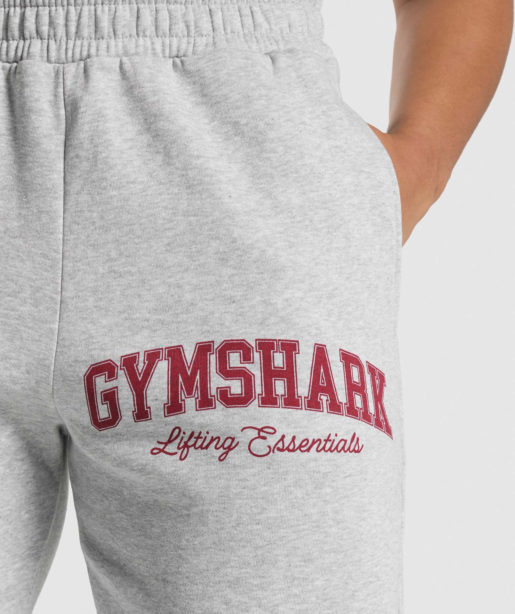 gymshark-lifting-essentials-graphic-brushed-oversized-joggers-light-grey-core-marl-ss25