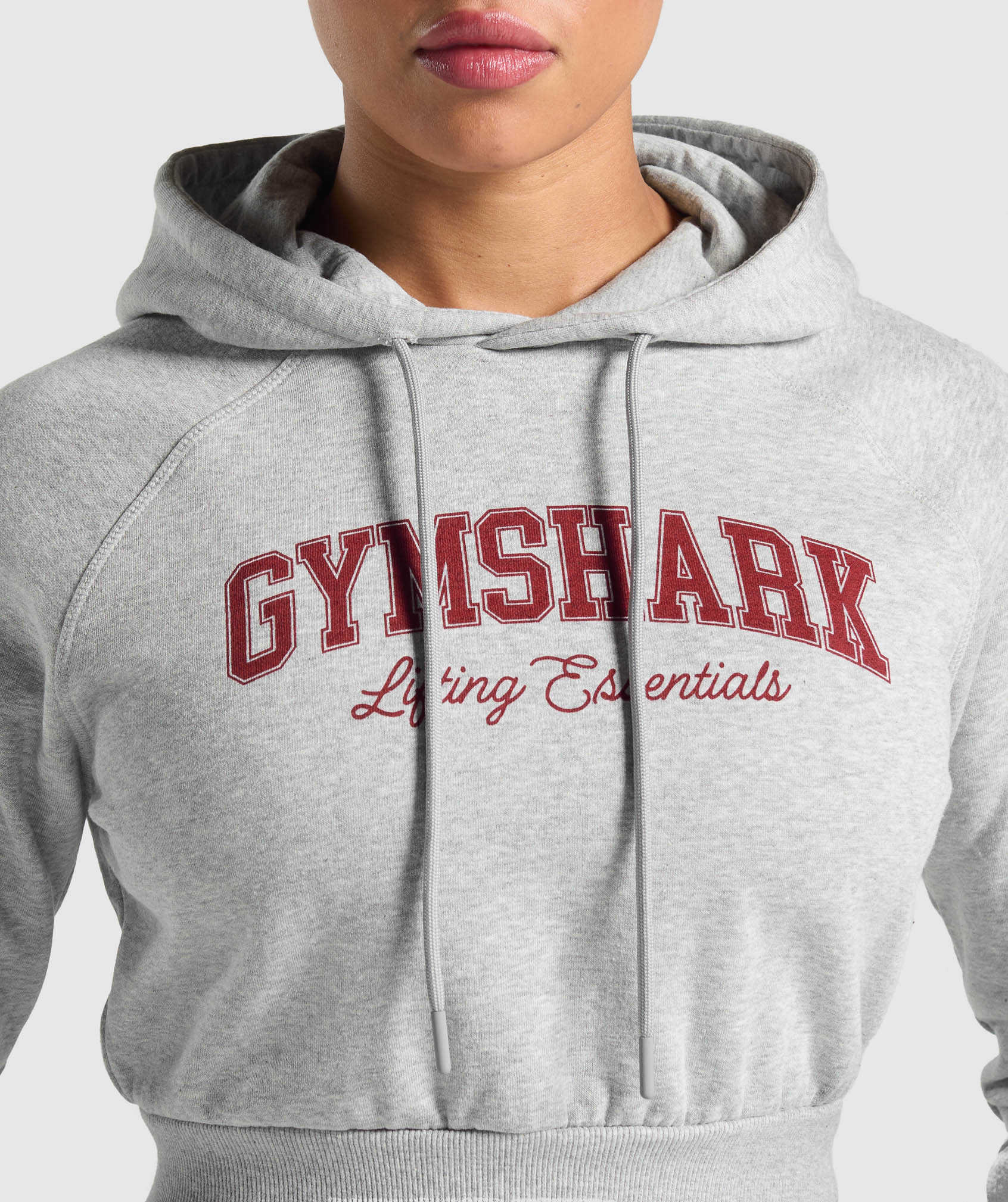 gymshark-lifting-essentials-graphic-cropped-hoodie-light-grey-core-marl-ss25
