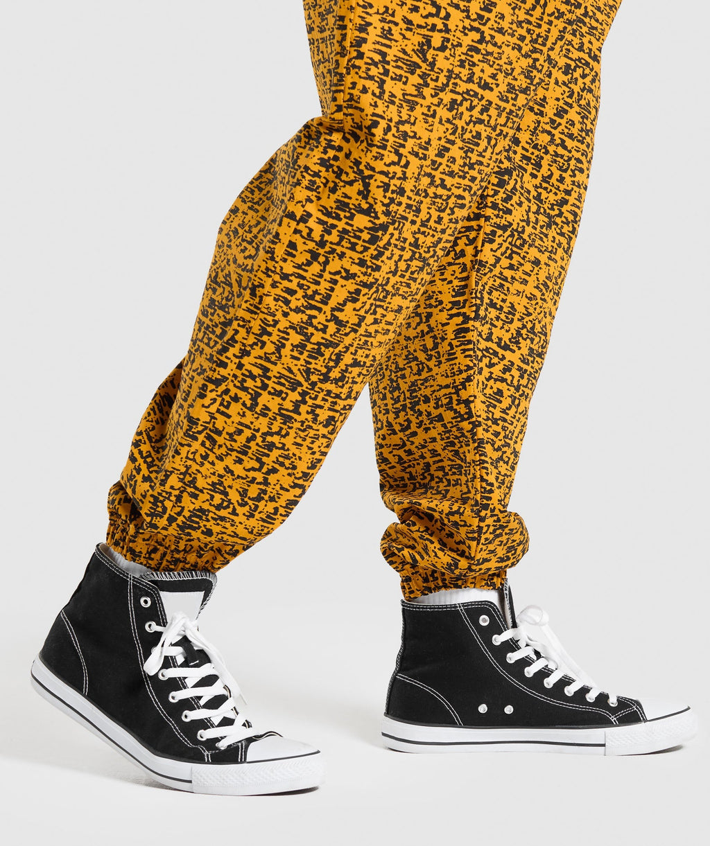 gymshark-printed-pumper-pants-burnt-yellow-ss24
