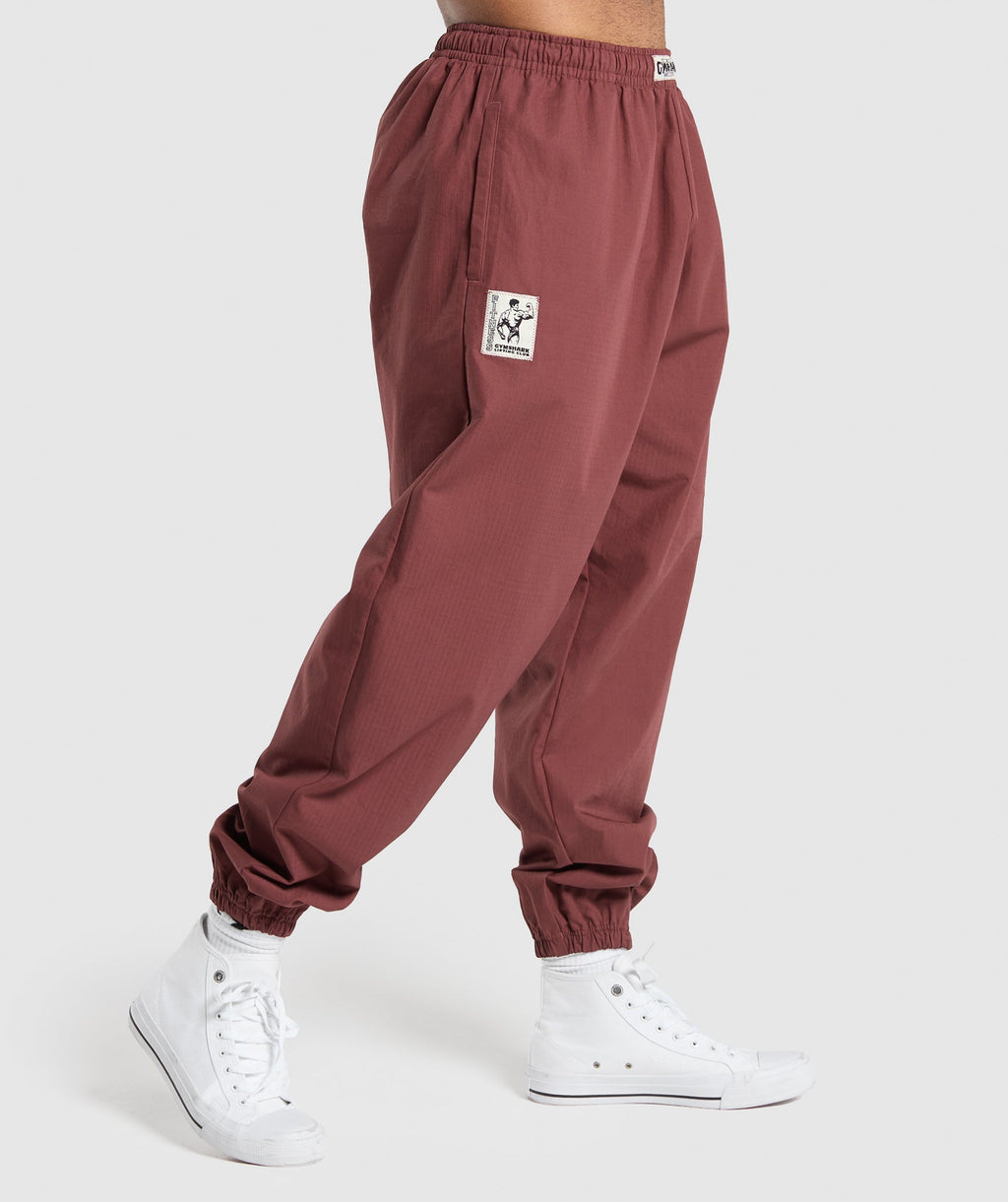 gymshark-pumper-pants-burgundy-brown-ss24