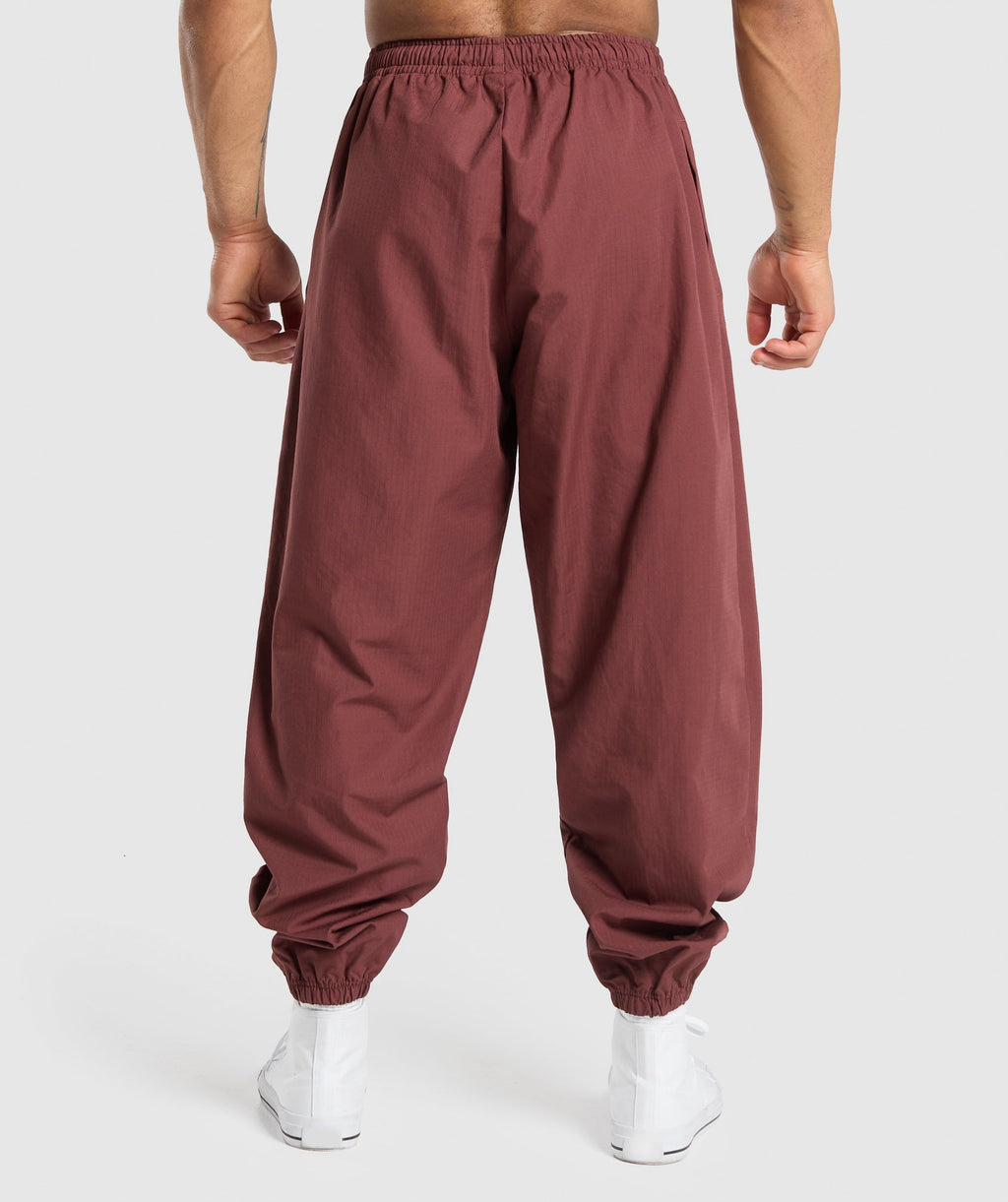 gymshark-pumper-pants-burgundy-brown-ss24
