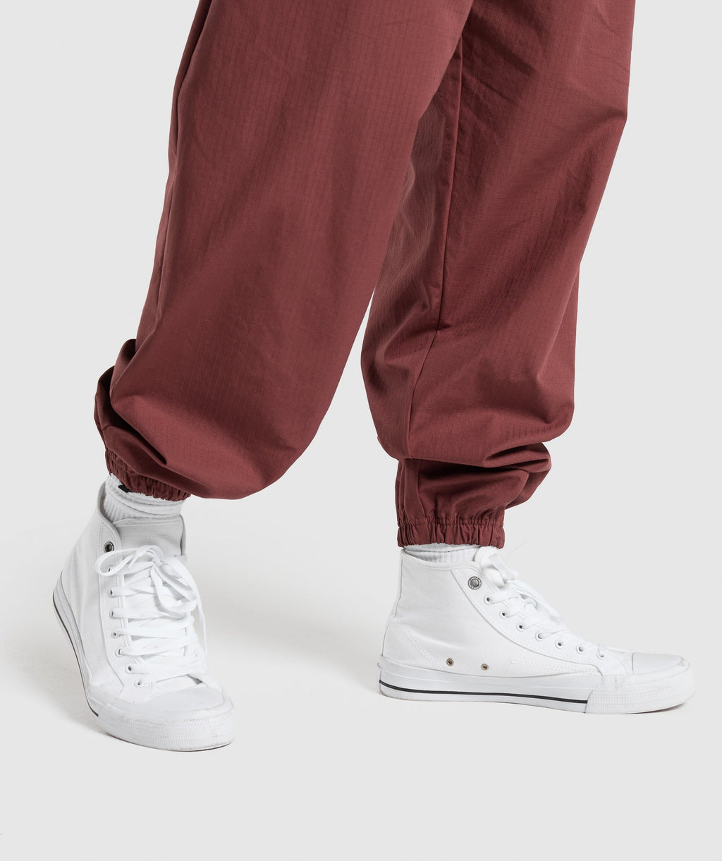 gymshark-pumper-pants-burgundy-brown-ss24