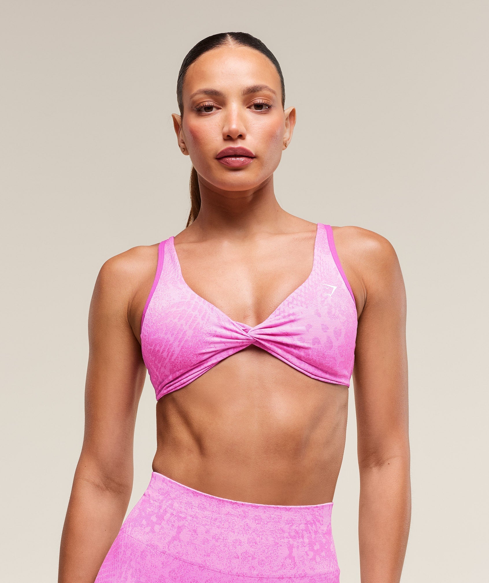 gymshark-adapt-x-whitney-animal-seamless-twist-front-bra-sour-pink-vibrant-pink-ss25