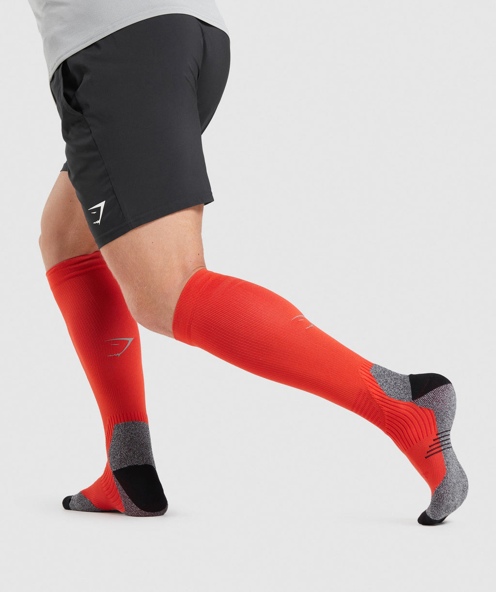 gymshark-long-performance-socks-papaya-orange-ss22