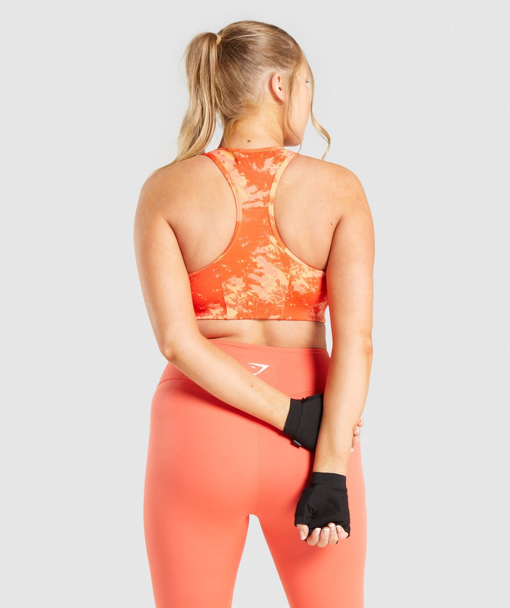 gymshark-essential-racerback-training-sports-bra-orange-camo-print