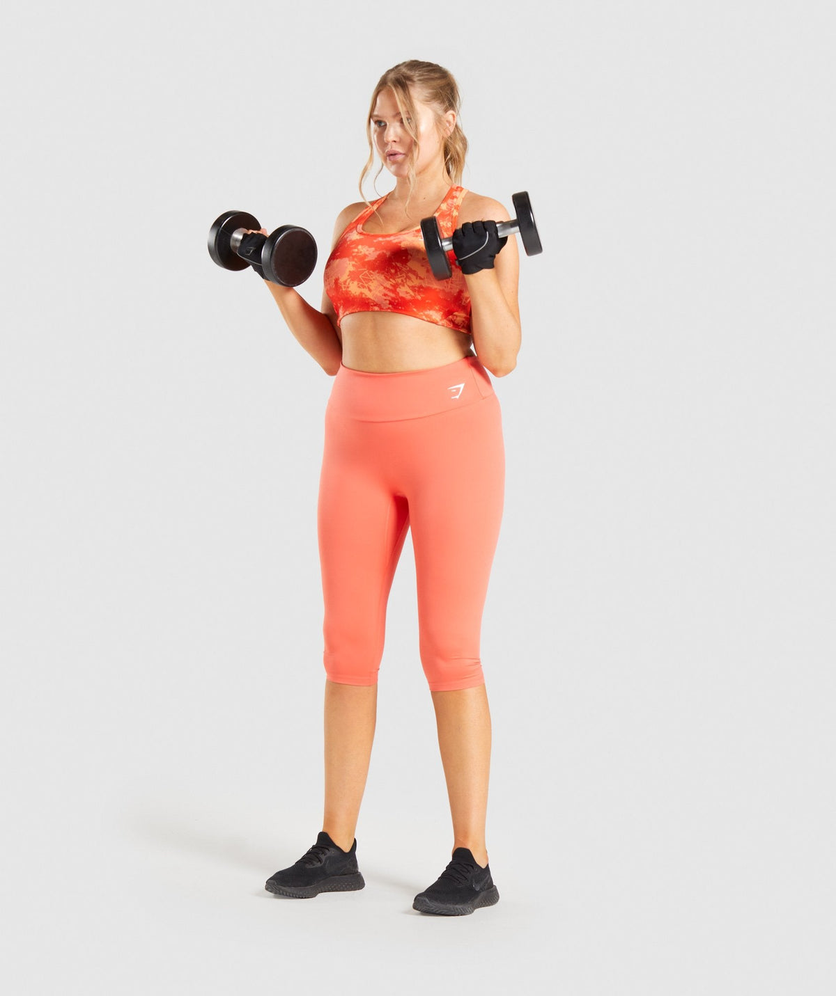 gymshark-essential-racerback-training-sports-bra-orange-camo-print