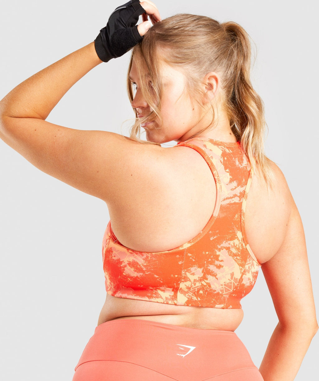 gymshark-essential-racerback-training-sports-bra-orange-camo-print