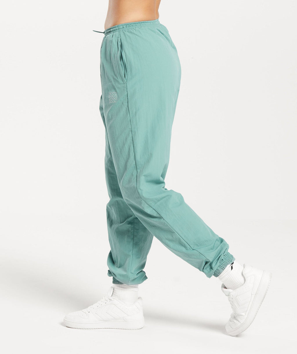 gymshark-monogram-woven-joggers-ink-teal-aw23