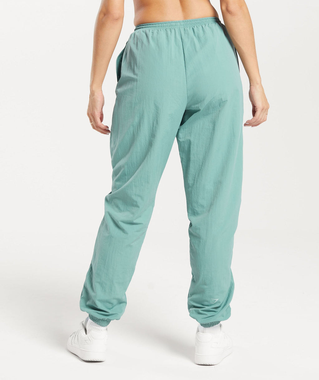 gymshark-monogram-woven-joggers-ink-teal-aw23