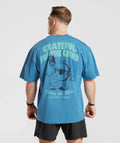 gymshark-noah-ohlsen-oversized-sun-t-shirt-coastal-blue-ss23
