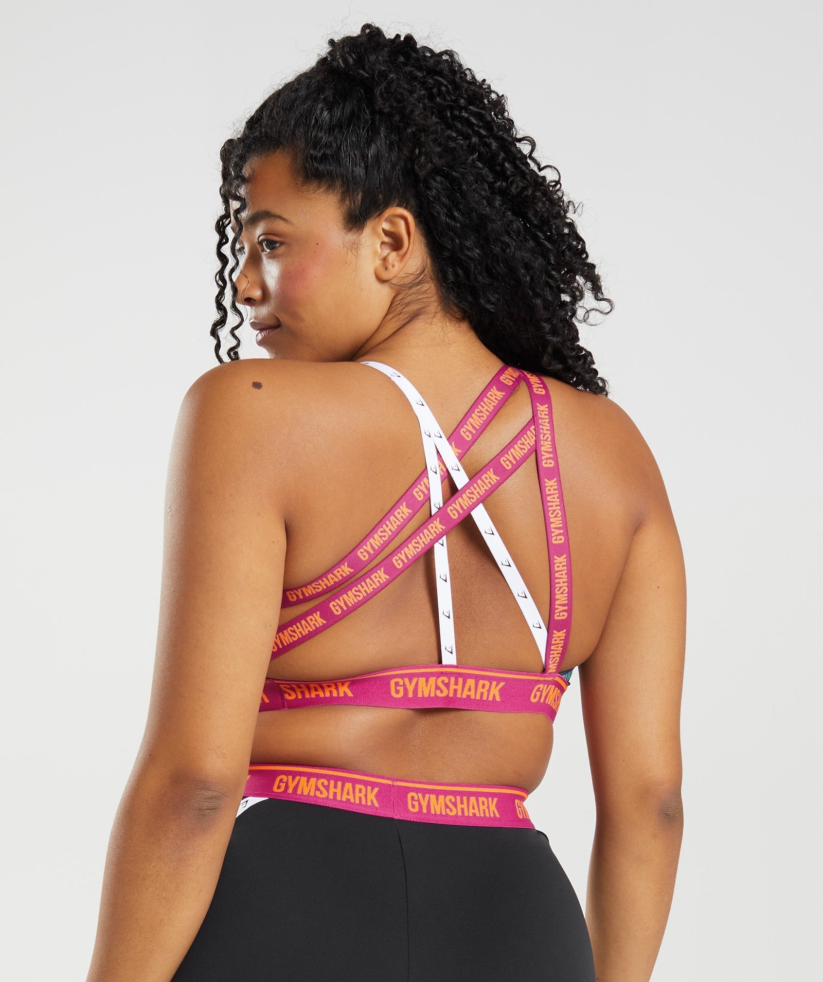 gymshark-strike-sports-bra-black-dragon-pink-alpine-green-ss22