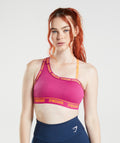 gymshark-strike-sports-bra-dragon-pink-horizon-orange-ss22