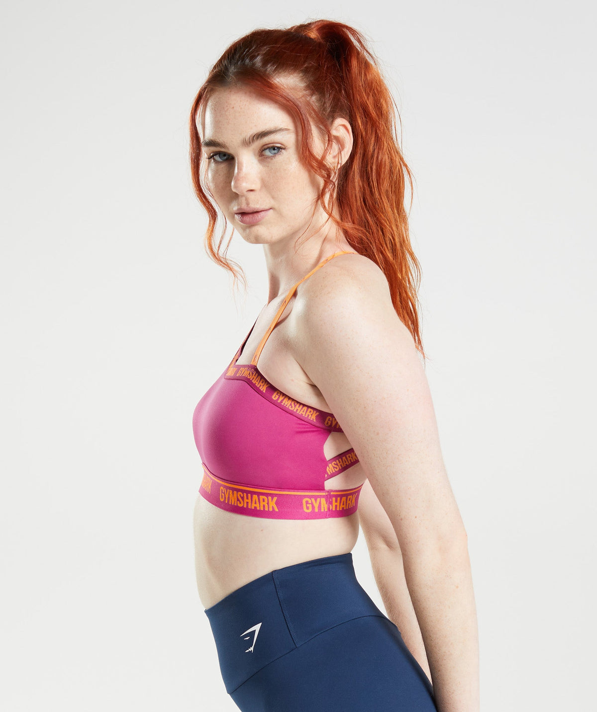 gymshark-strike-sports-bra-dragon-pink-horizon-orange-ss22