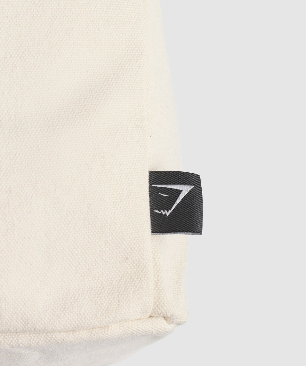 gymshark-weight-plate-oversized-tote-oat-white-carmine-red-ss25