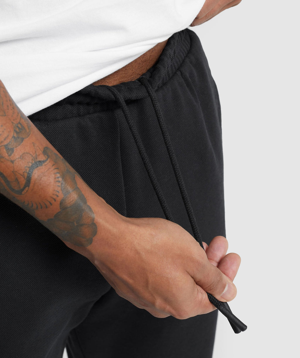 gymshark-pique-joggers-black-onyx-grey-ss24