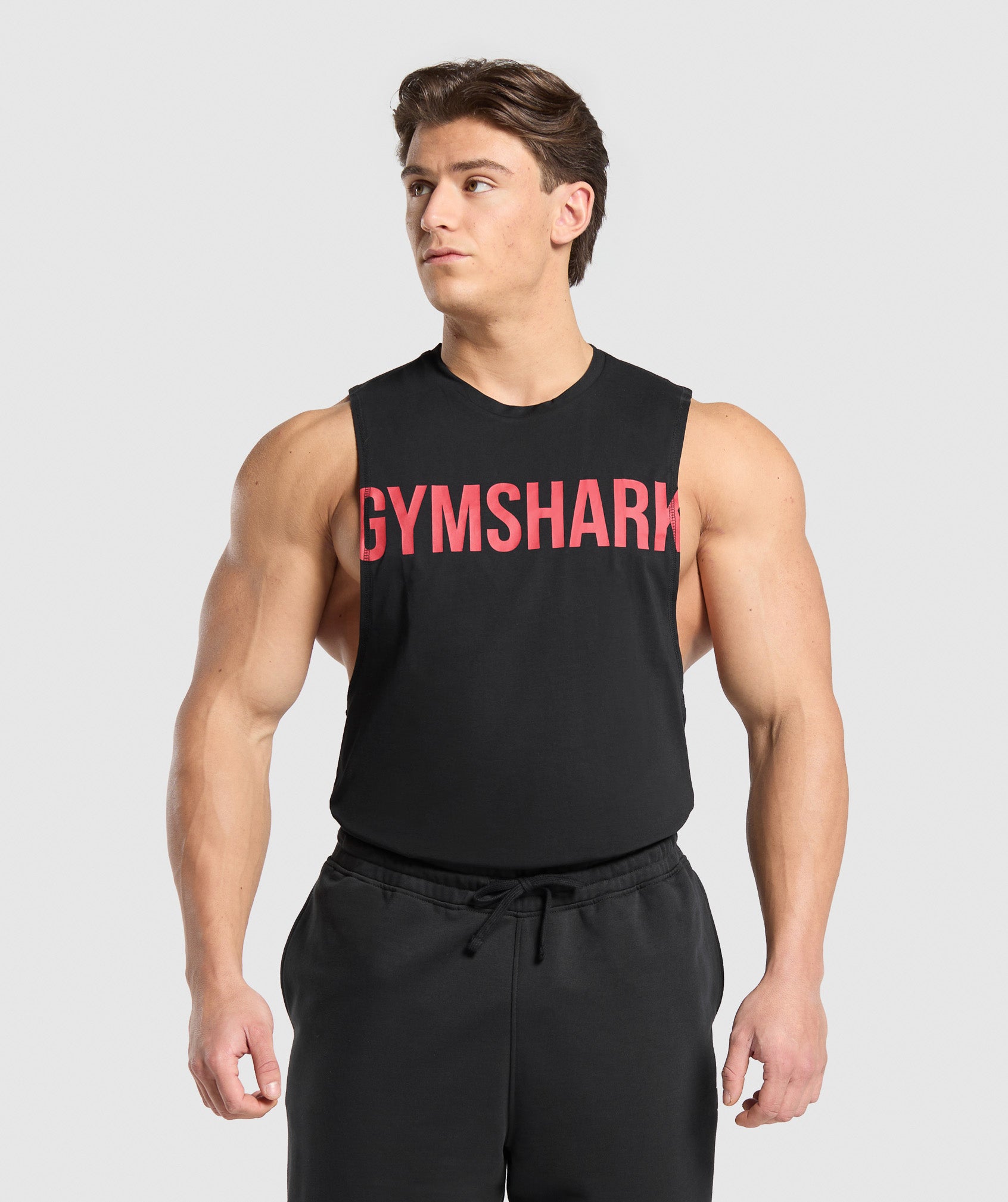 gymshark-prime-drop-arm-tank-black-vivid-red-ss25