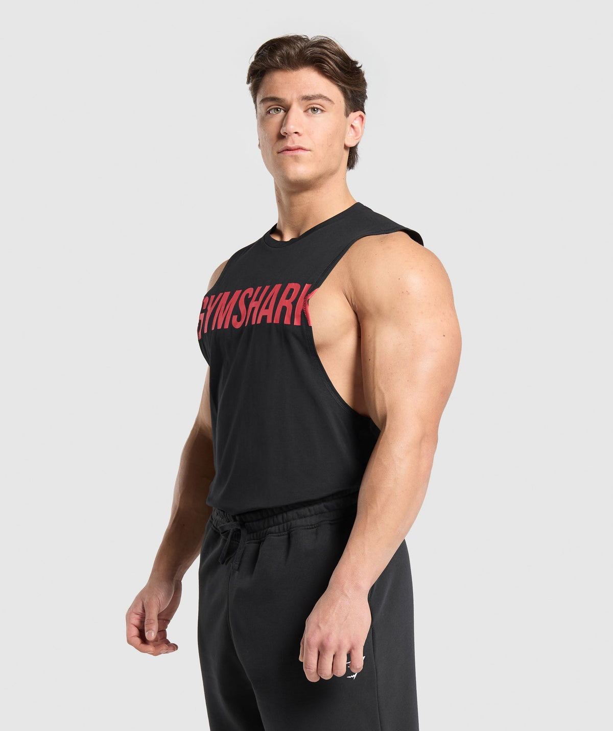 gymshark-prime-drop-arm-tank-black-vivid-red-ss25