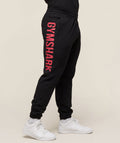 gymshark-prime-joggers-black-vivid-red-ss25